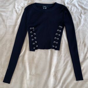 Black cropped sweater top with lace up detail on the front